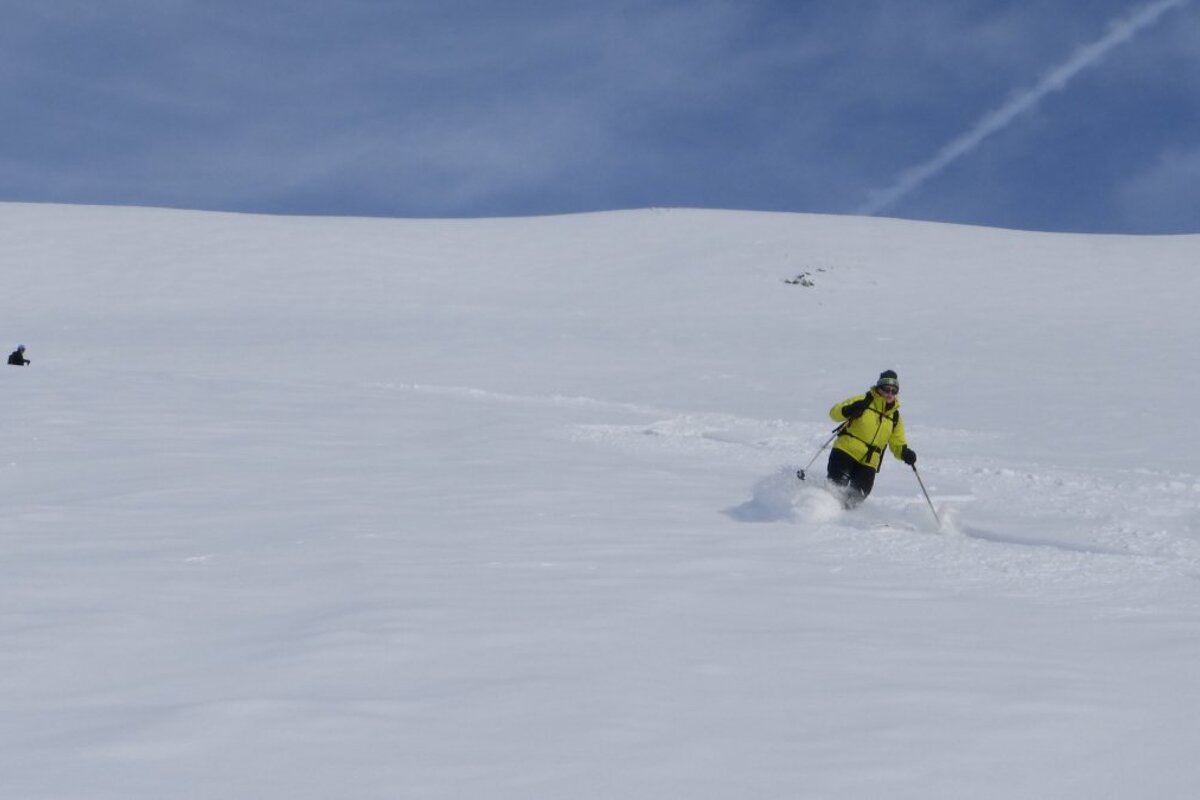 skiers in fresh powder in val disere