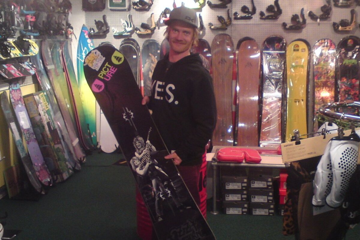 a man in a snowboard shop