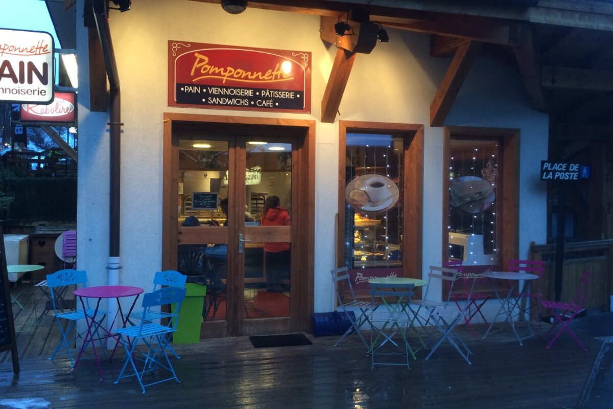 the outside of a small coffee shop and bakery in morzine