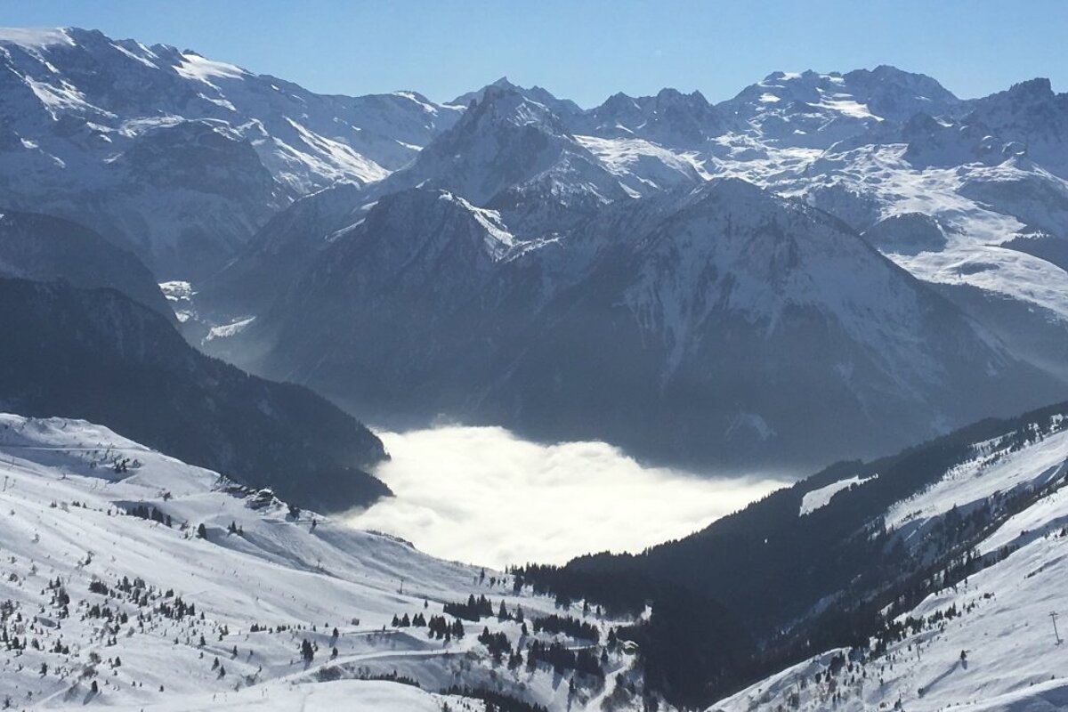 clouds engulfing a village in la plagne