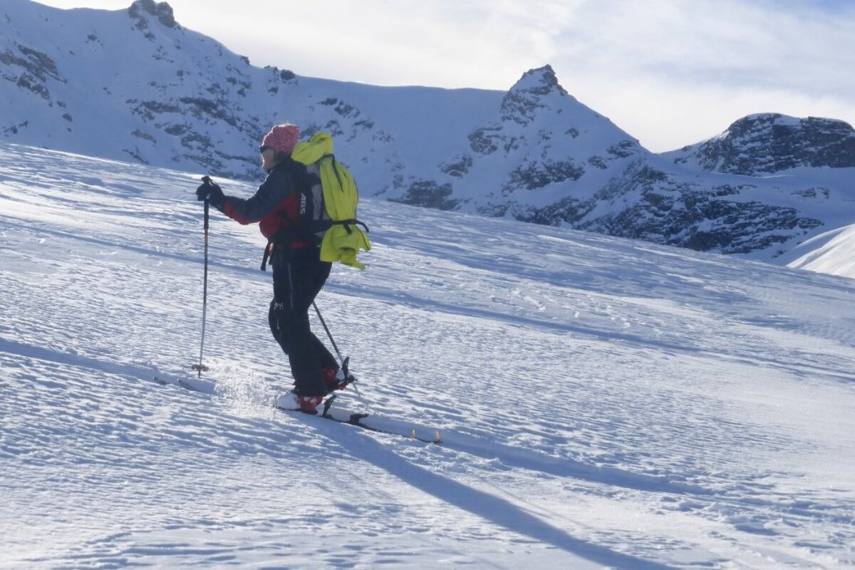 a skier going uphill