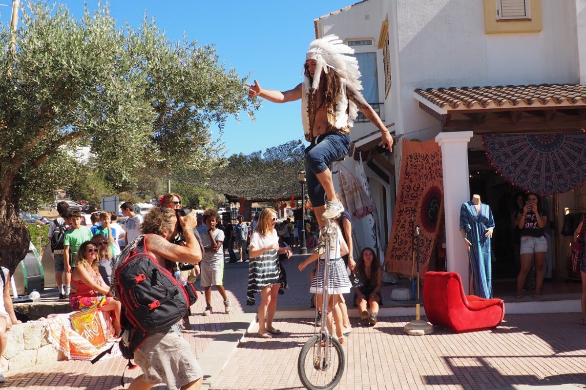 unicyclists entertaining crowds at san carlos music festival ibiza