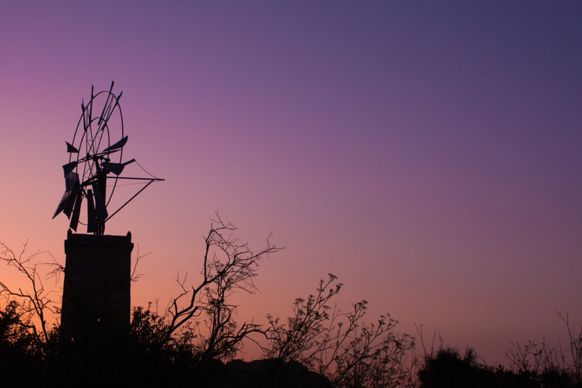 Windmill silhouette at sineu in mallorca - sunrise