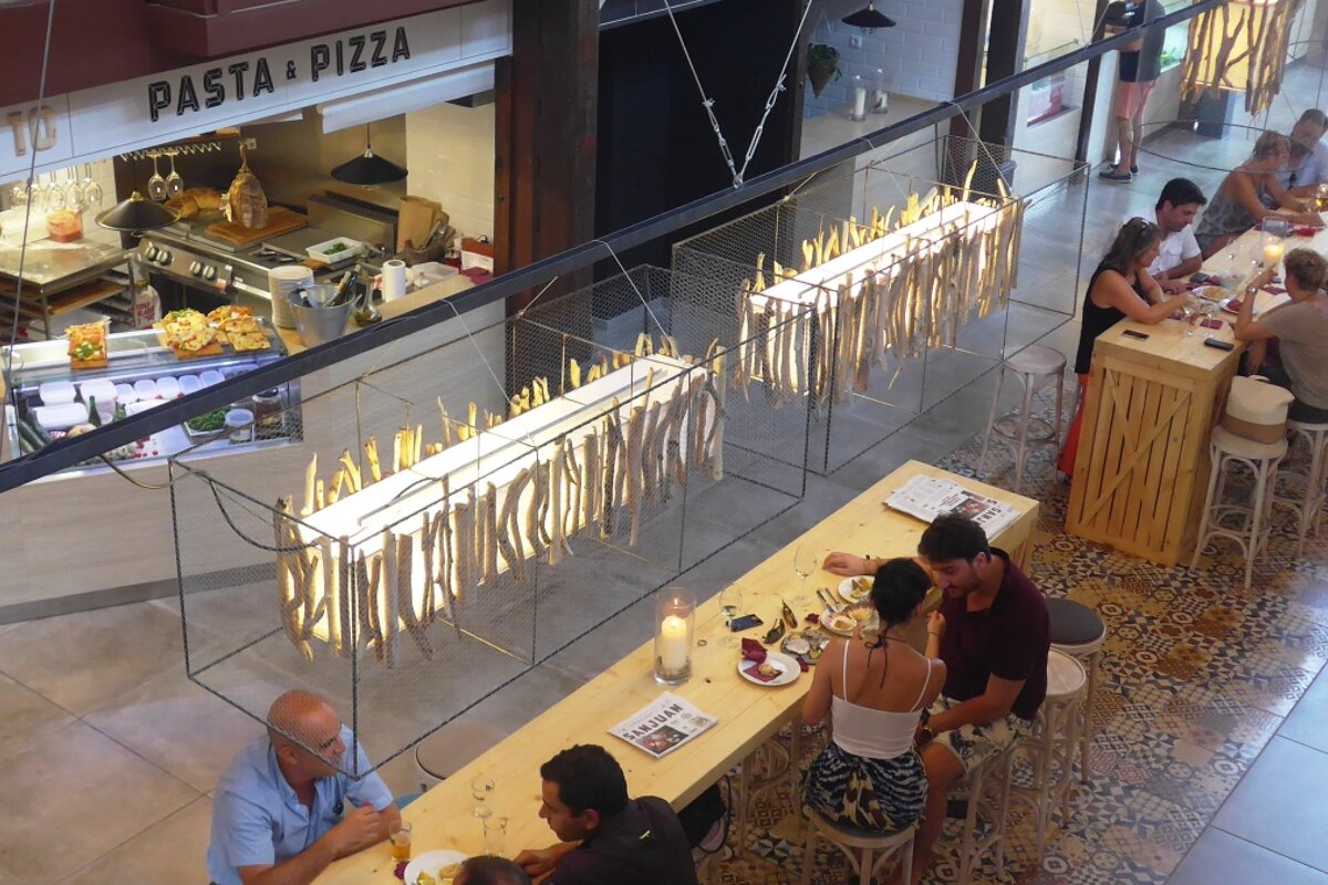 looking down at the tables in san juan gastro food market in palma