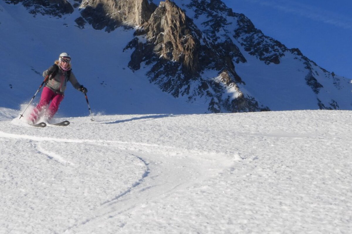 a woman skiing off piste