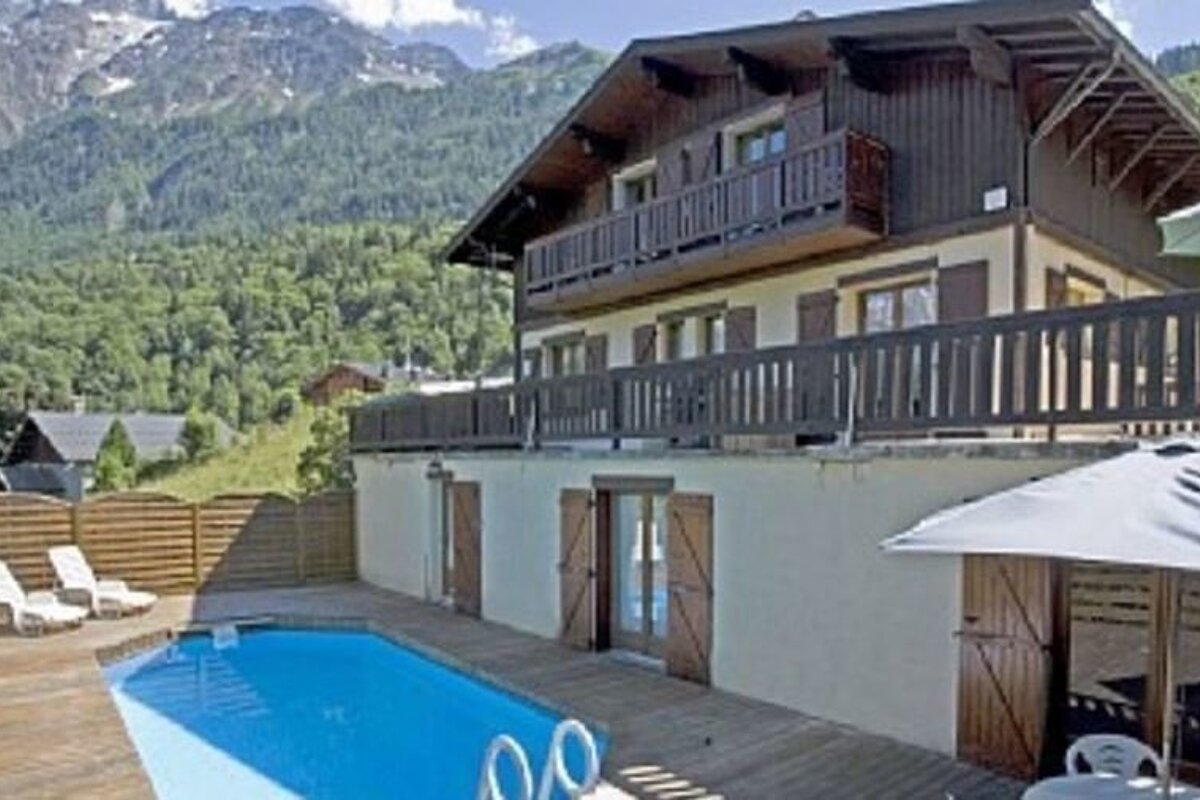 a chalet with a swimming pool