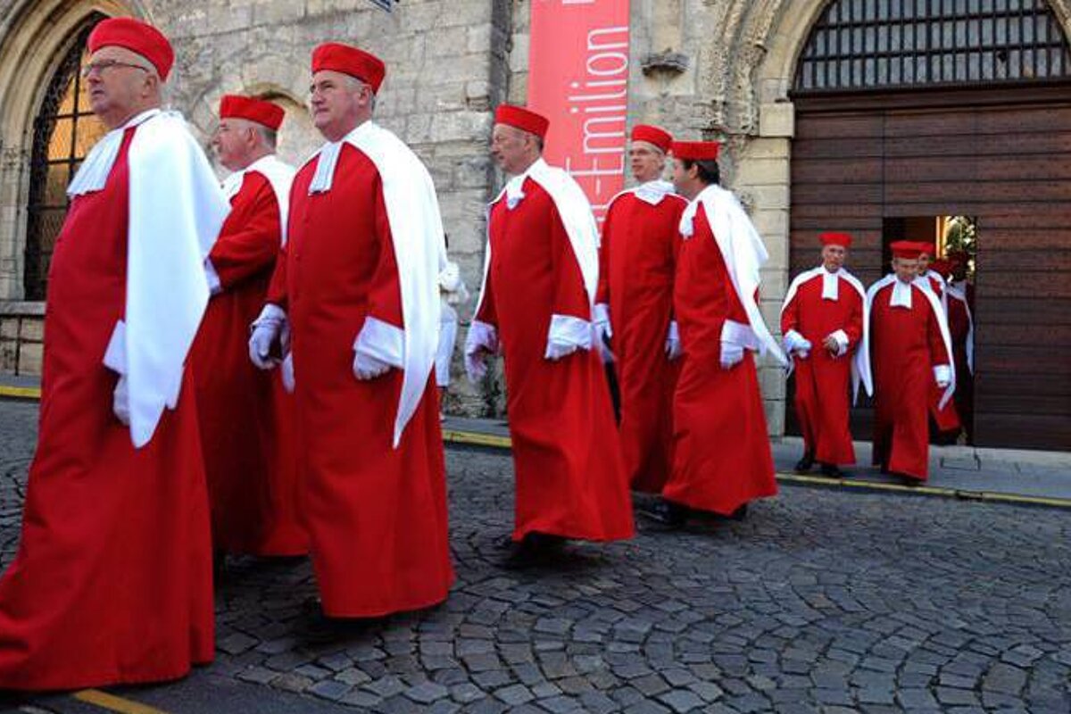 the jurade in saint emilion, parading in their red robes