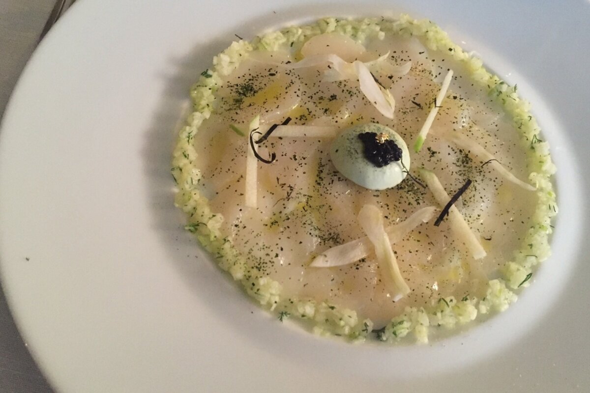 Scallops served with seaweed, caviar and a Granny Smith apple jus