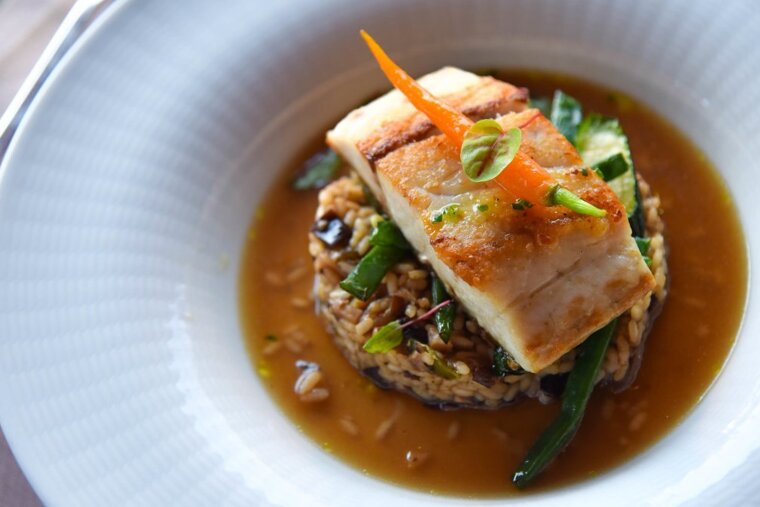 Croaker fish supreme with wild mushroom rice and consome