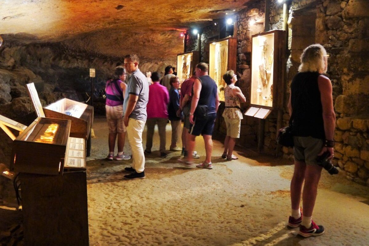 cavernous museum carved out of the rock at maison forte de reignac
