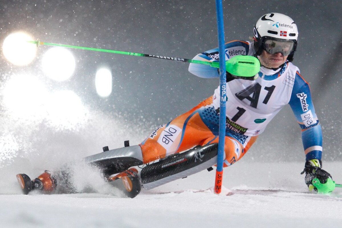 a ski racer going round a slalom pole