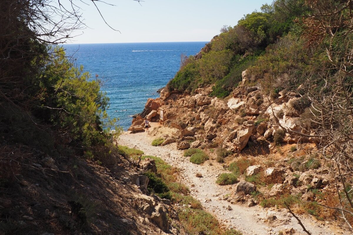 the walking trail that leads to the beach at cala yoga ibiza