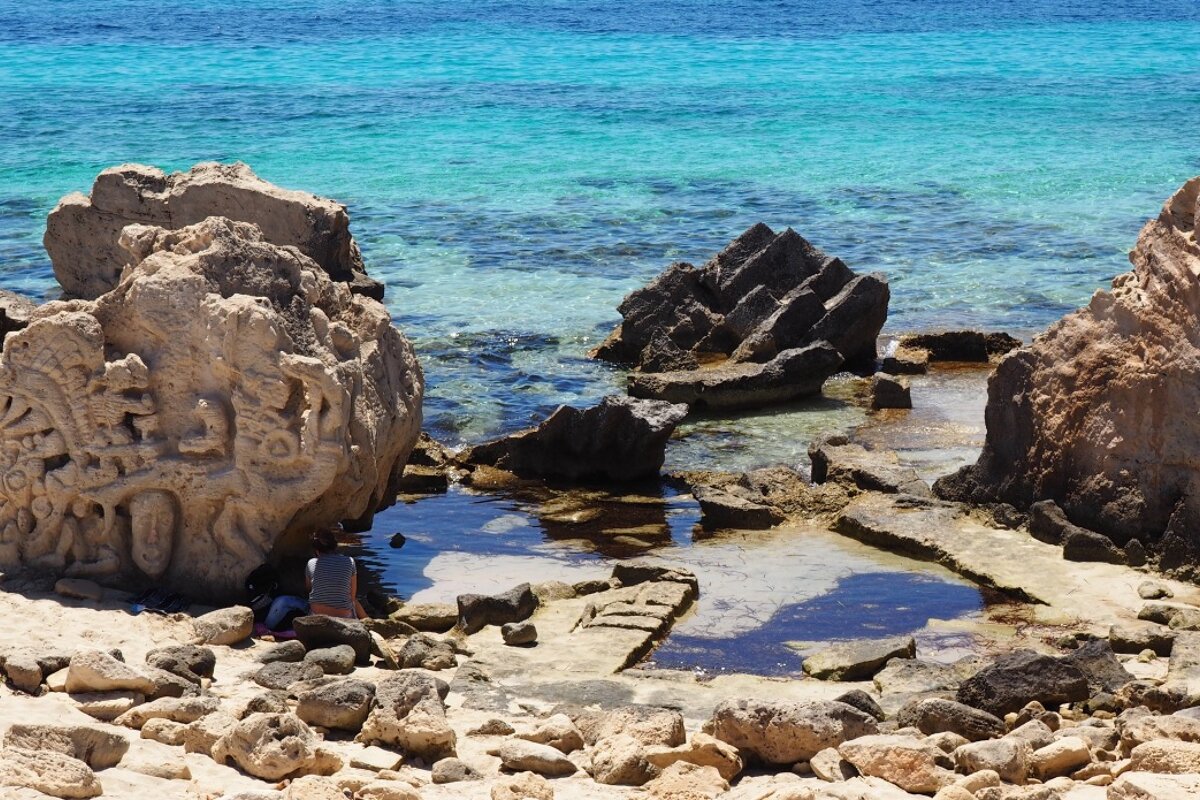 carvings on rocks on the south east tip of ibiza