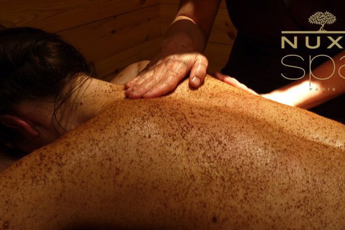 a woman gettnig a scrub massage