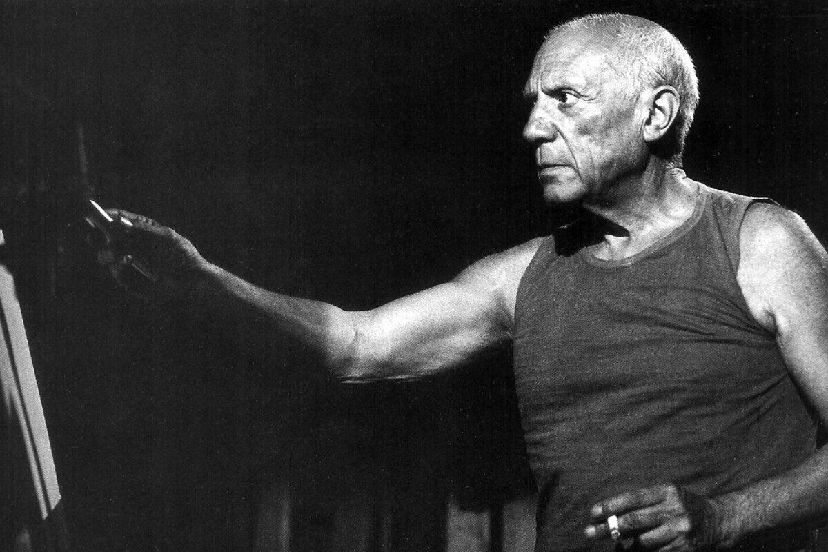 Pablo picasso by his painting easel - photo by Andre villars