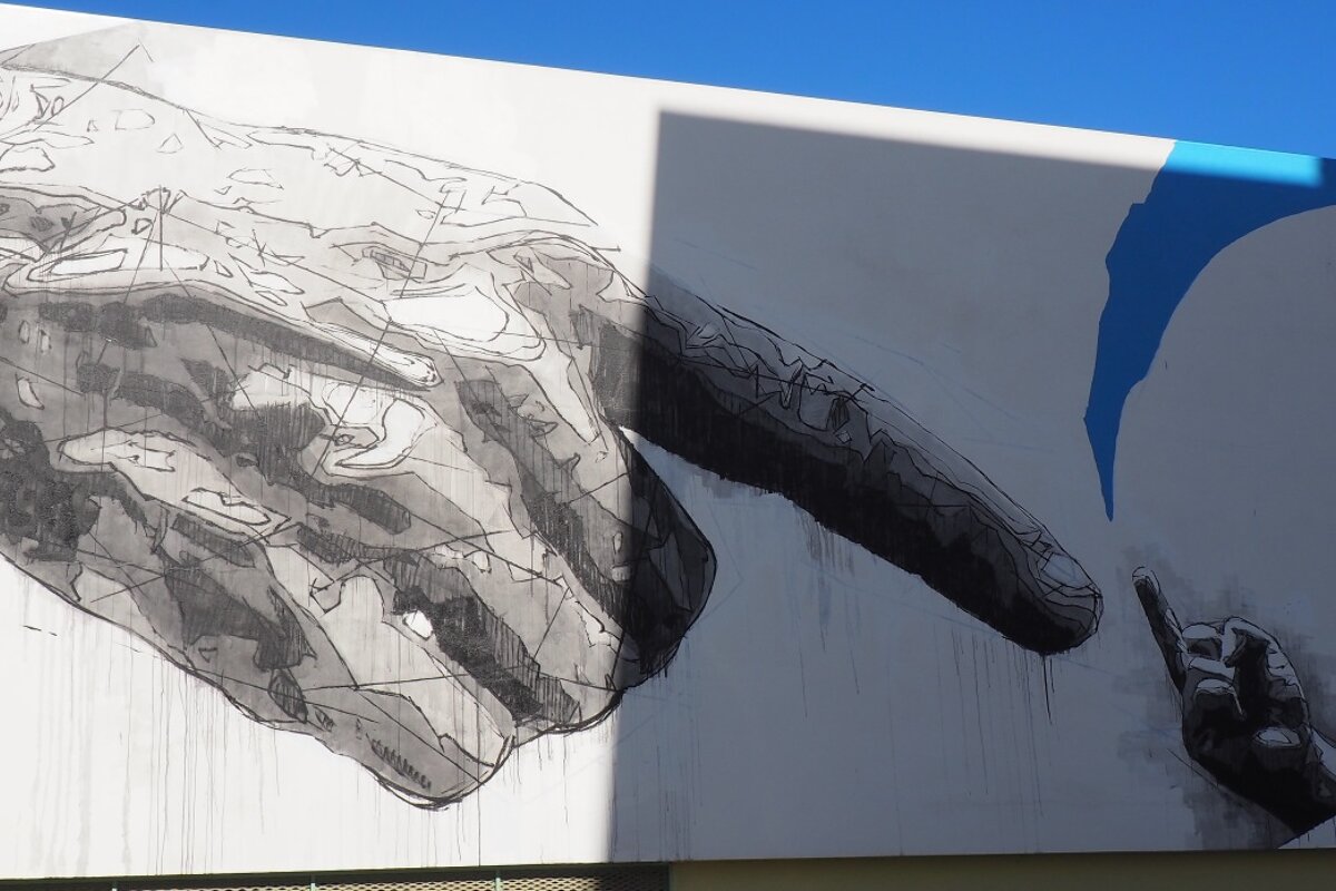 Controversial work of art on a wall in san antonio, created as part of Bloop Festival