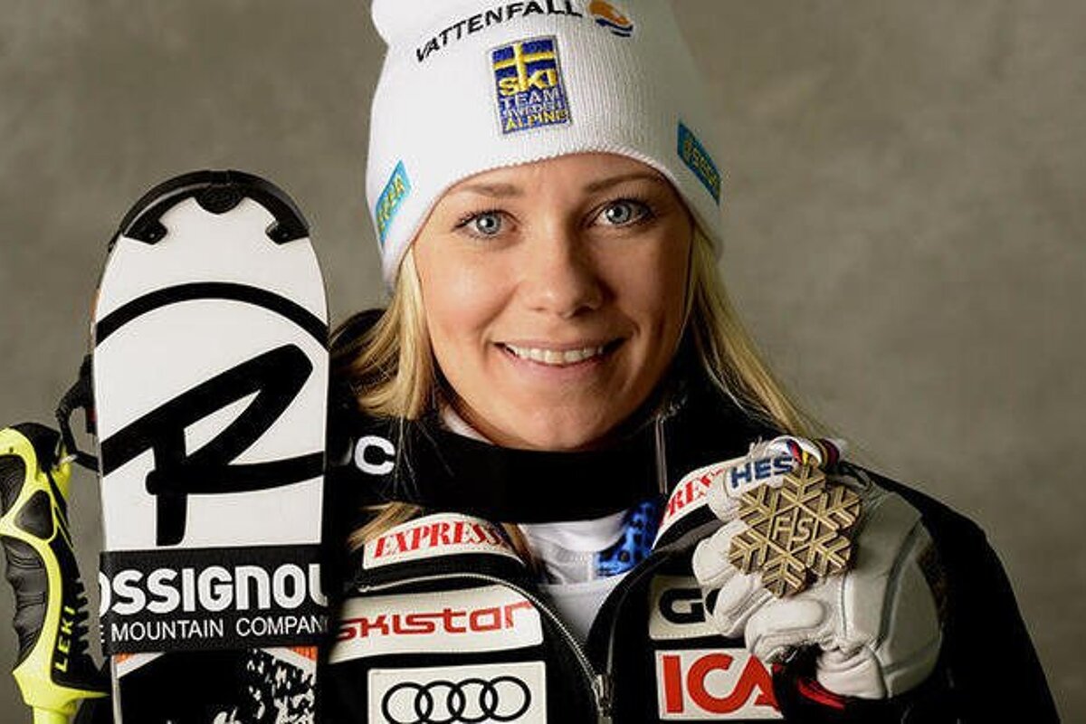 a ski racer with an olympic medal