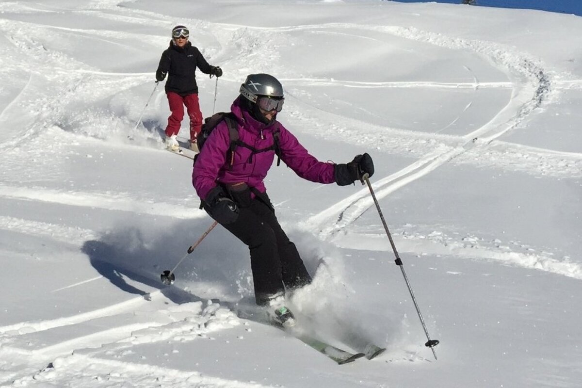 two skiers in fresh snow in meribel
