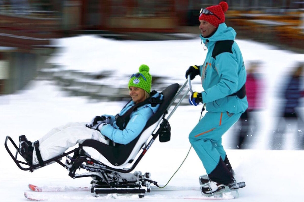 a person using a ski taxi in the ski resort of la plagne