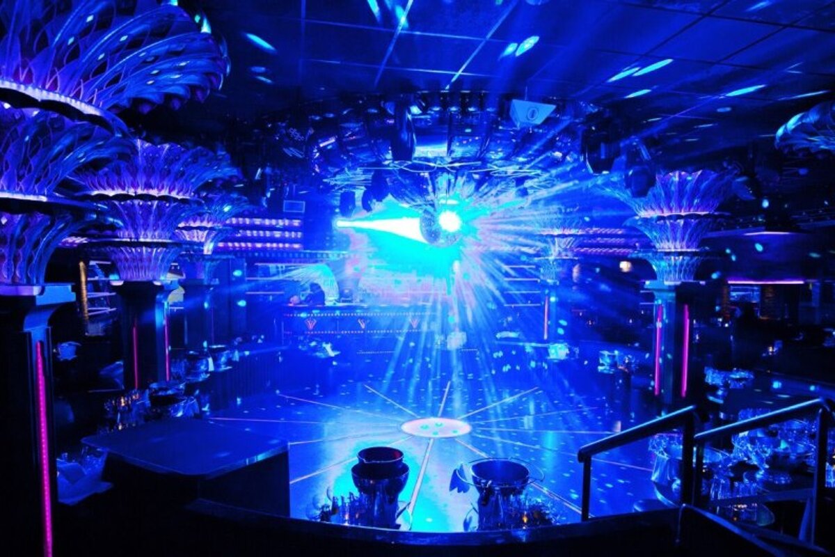 the blue lit interior of the Caves du Roy night club st tropez