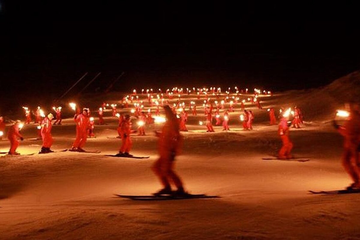 esf instructors doing a torchlit descent in courchevel