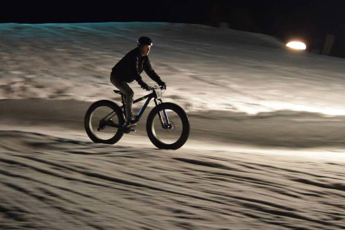 Fat biking fat biking at night on the pistes of courcehvel