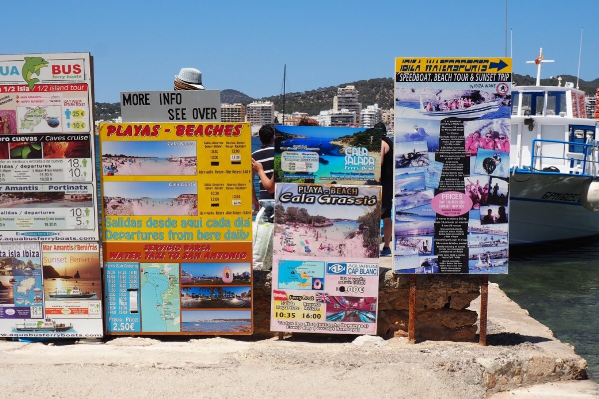 watersports nad boart trips being advertised on s'estanyol beach near san antonio ibiza