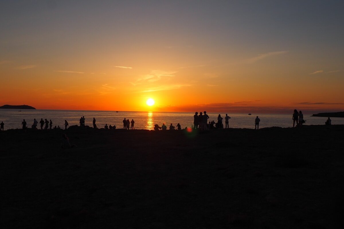 Crowds gather for sunset at sunset strip san antonio ibiza