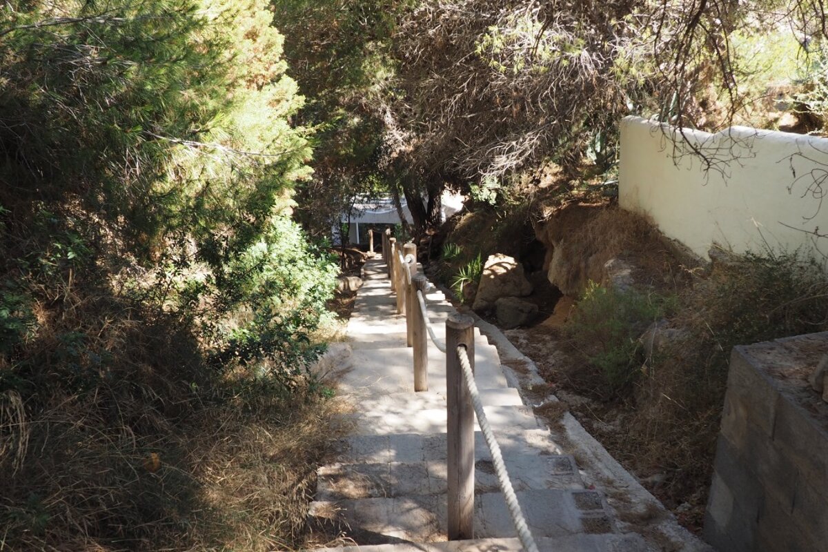 A set of steps leading down to the beach at cala codolar