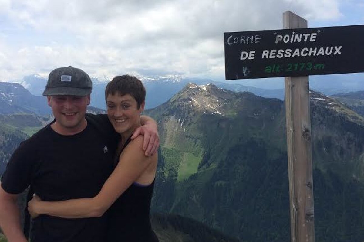 a couple on top of a mountain 