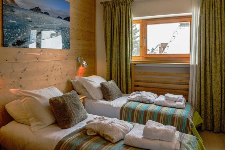 A twin bedroom in the apartment