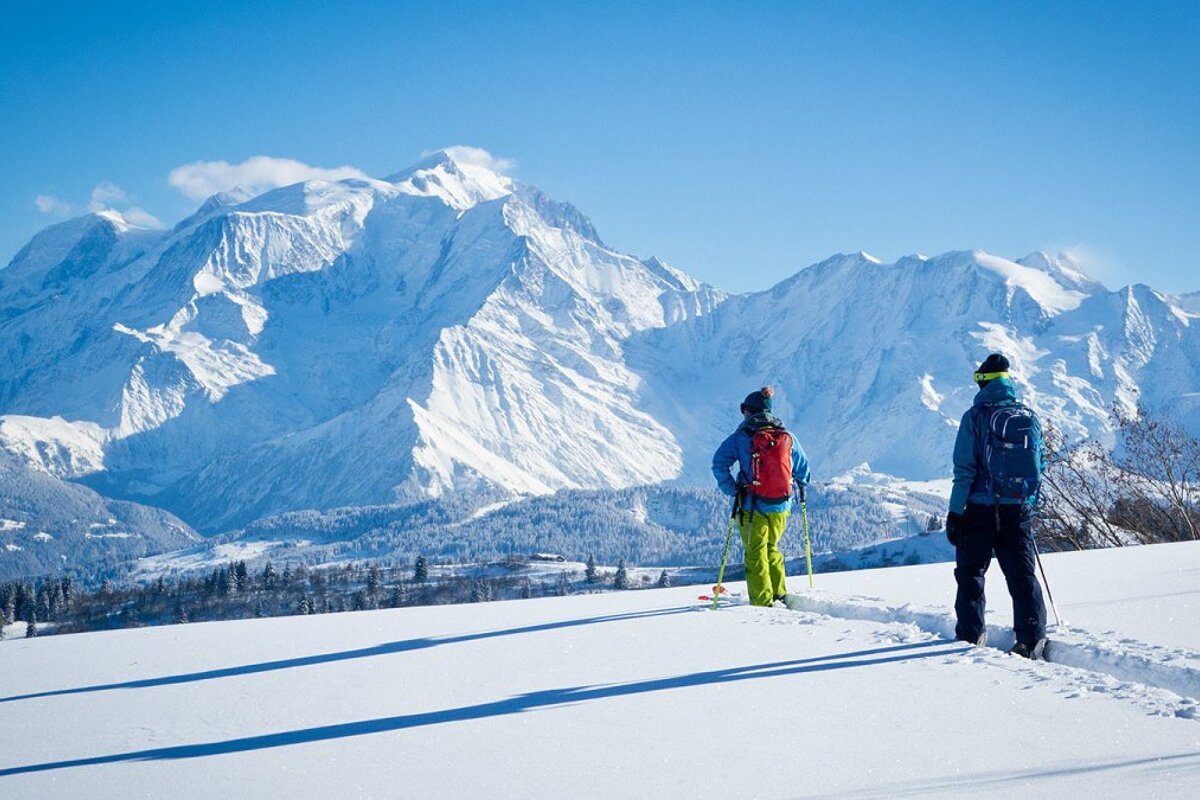 skiers in view of mont blanc