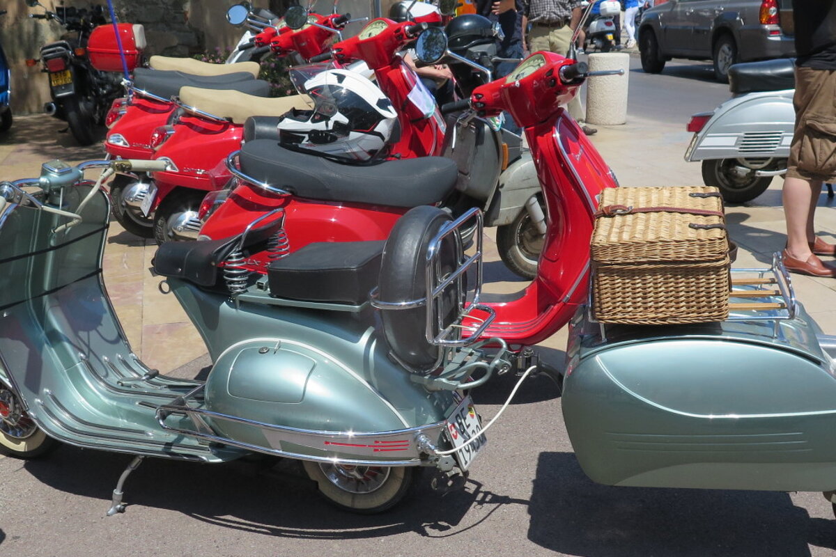Vespa with a trailer and picnic basket on the back in st tropez