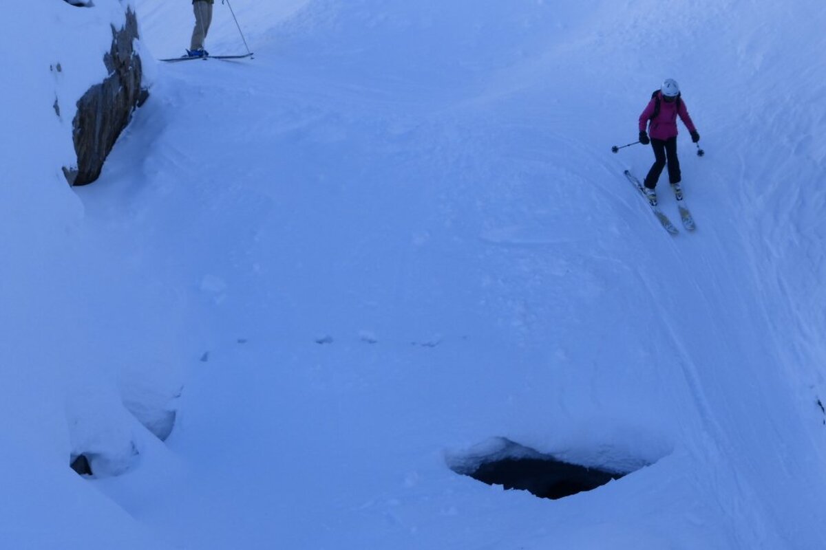 a skier in a gully