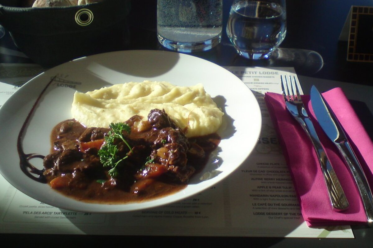 a plate of beef and potatoes