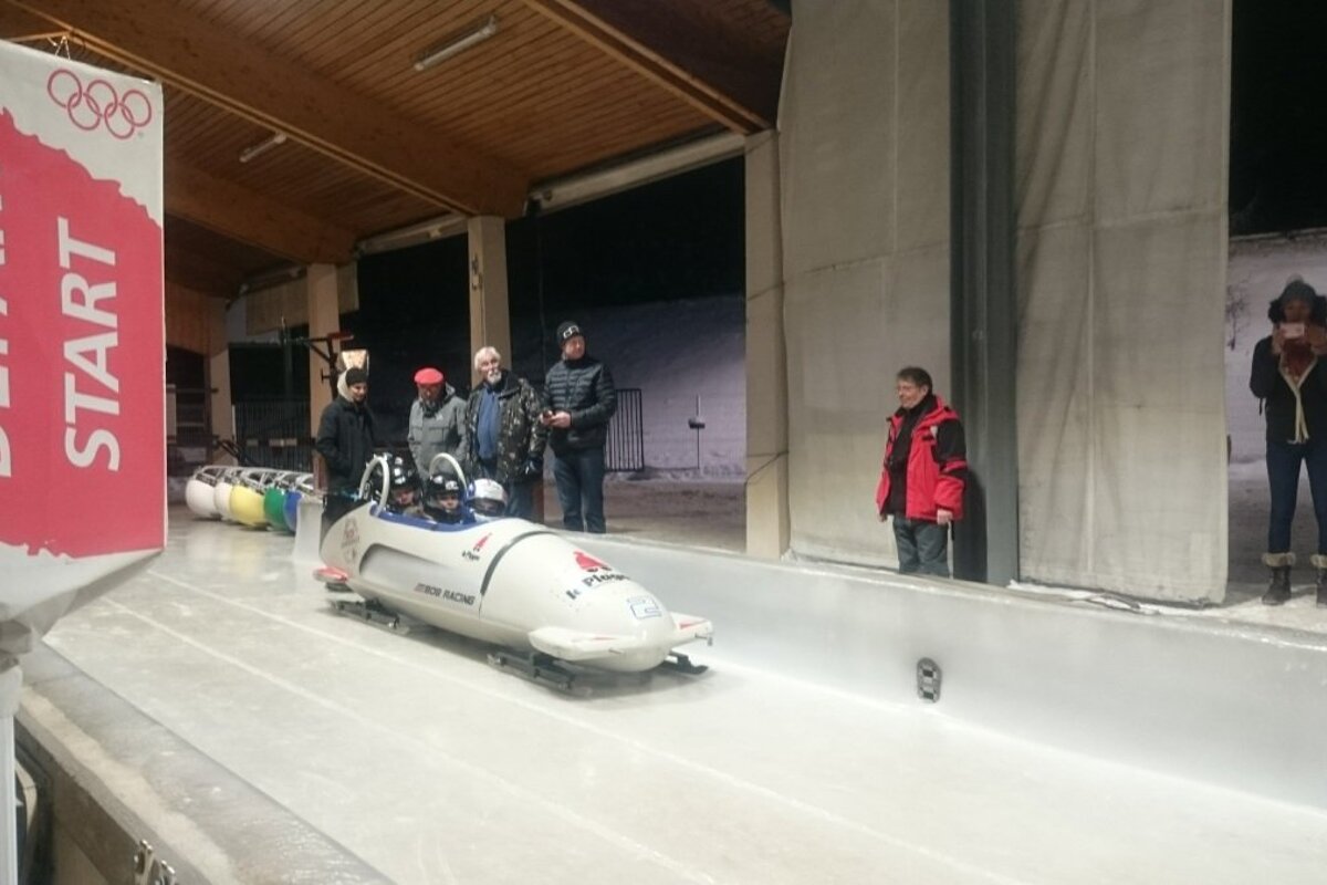 people in a bobsleigh in la plagne