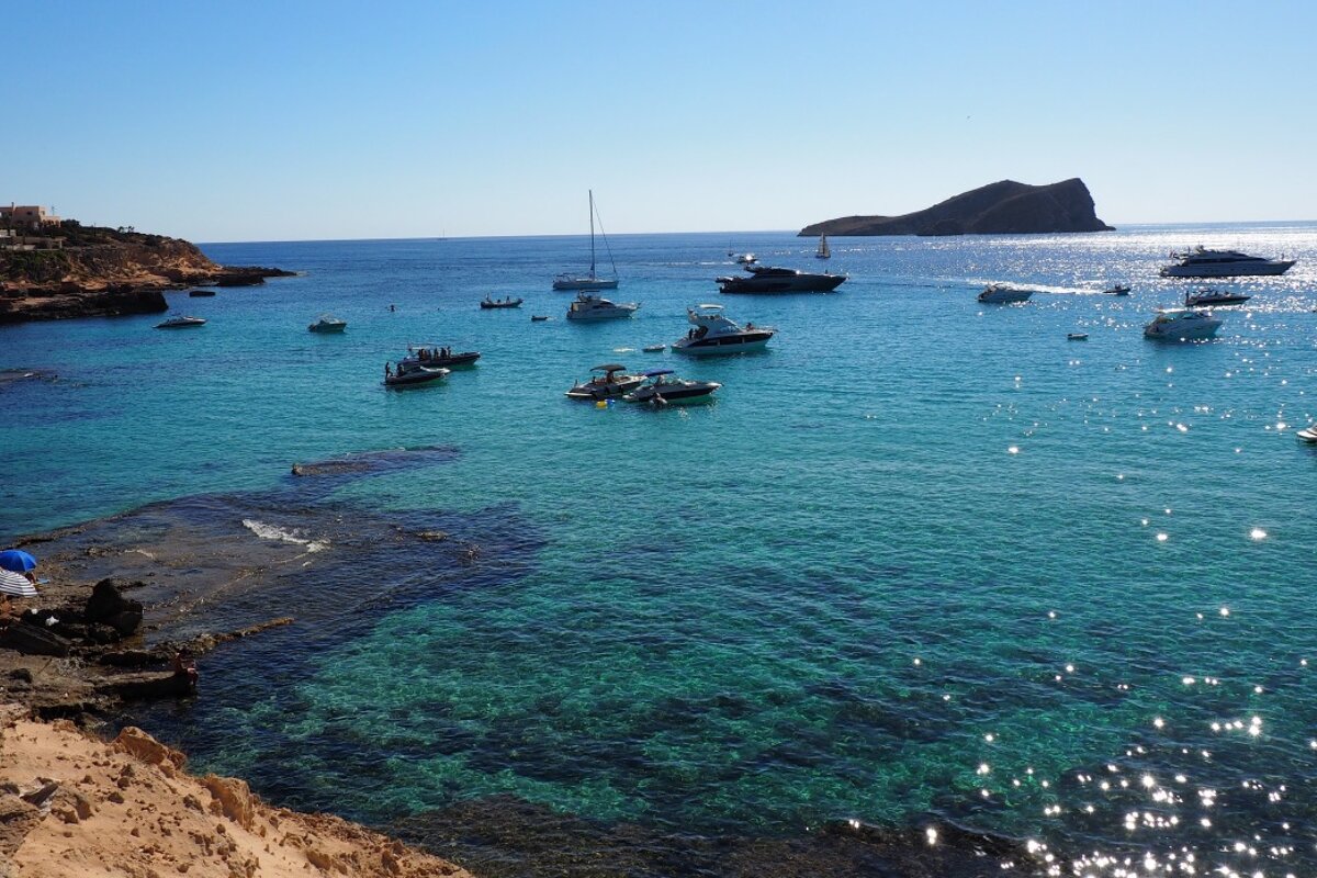 stunning clear blue waters of cala conta west ibiza