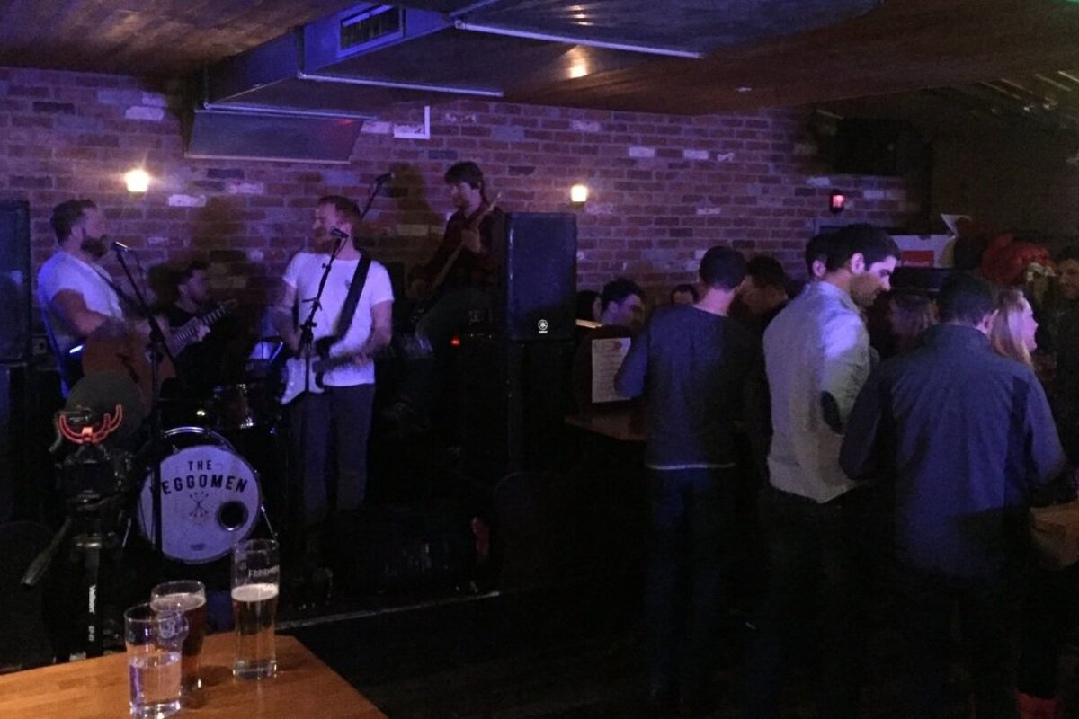 a band playing in a bar in alpe dhuez