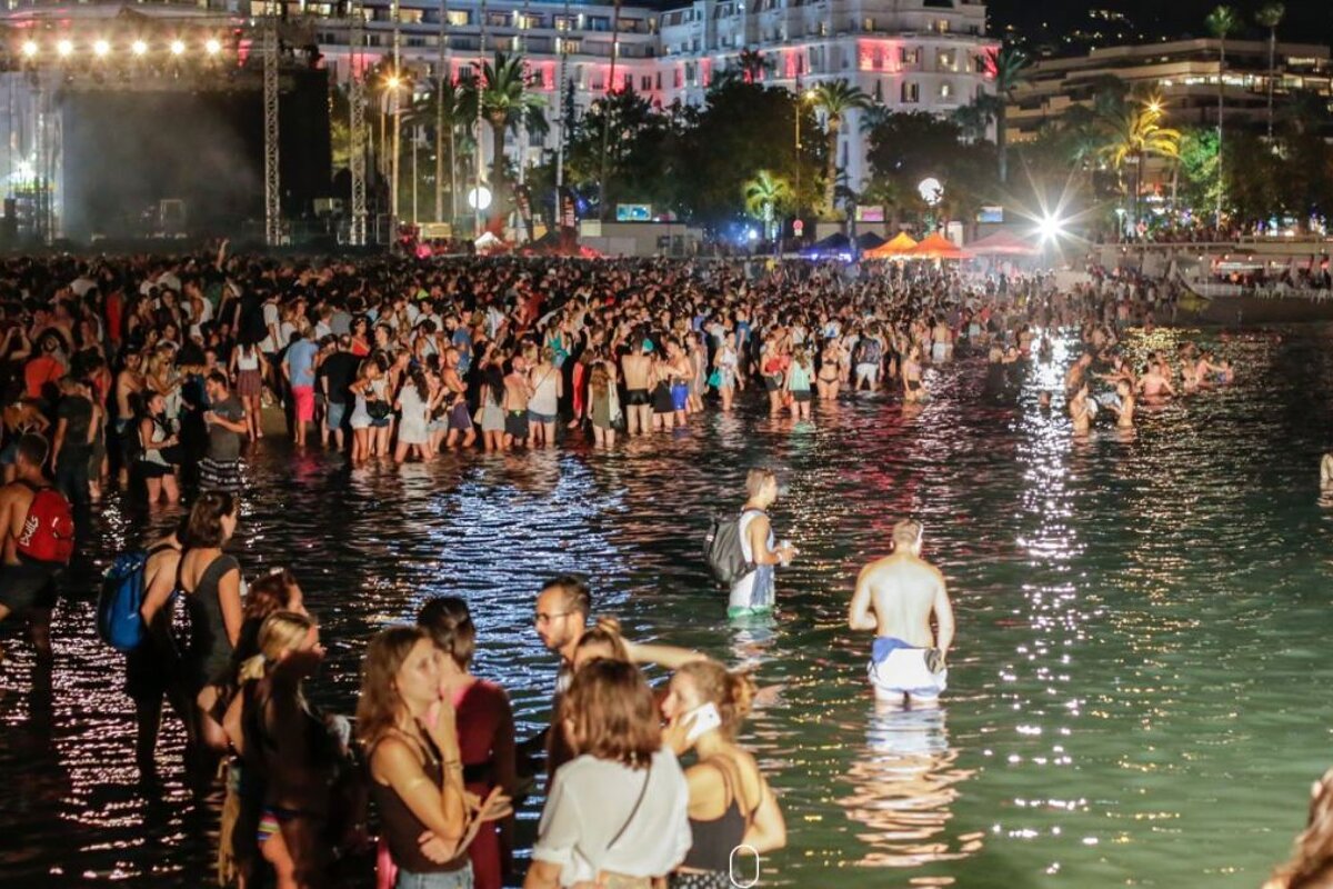 people in the water during an electronic festival in cannes