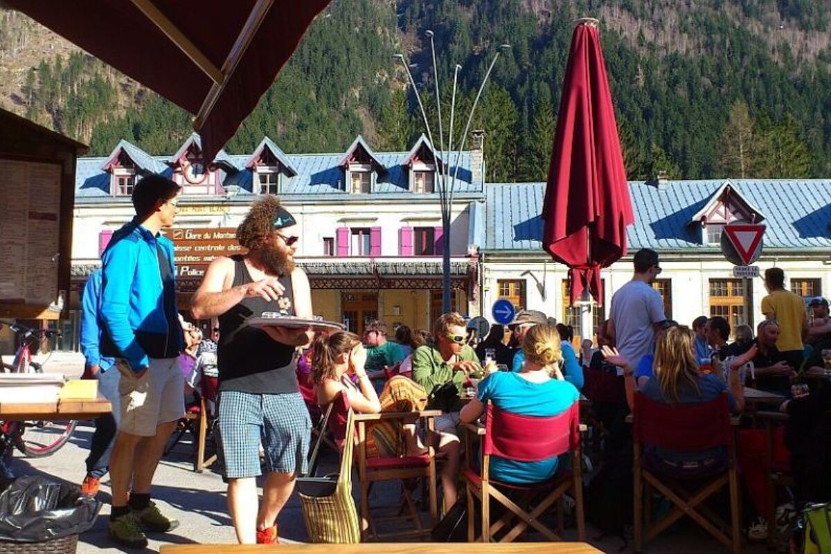 People enjoying drinks on the terrace outside Elevation bar in Chamonix